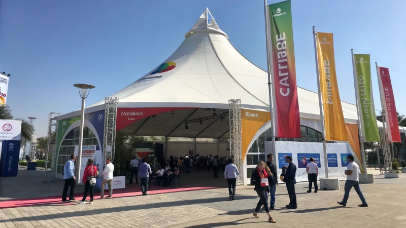 Outdoor trade show tent with vibrant branding and diverse visitors