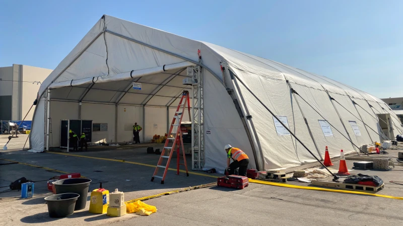 Damaged industrial tent in an outdoor setting